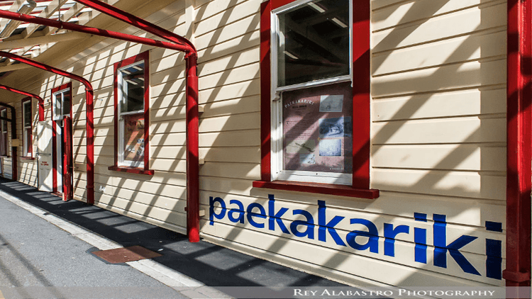 Railway station, cream with red accents, "Paekākāriki" written on side