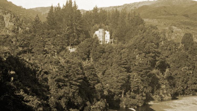Image of McCurdy's Castle in its location amongst the bush adjust to the river.
